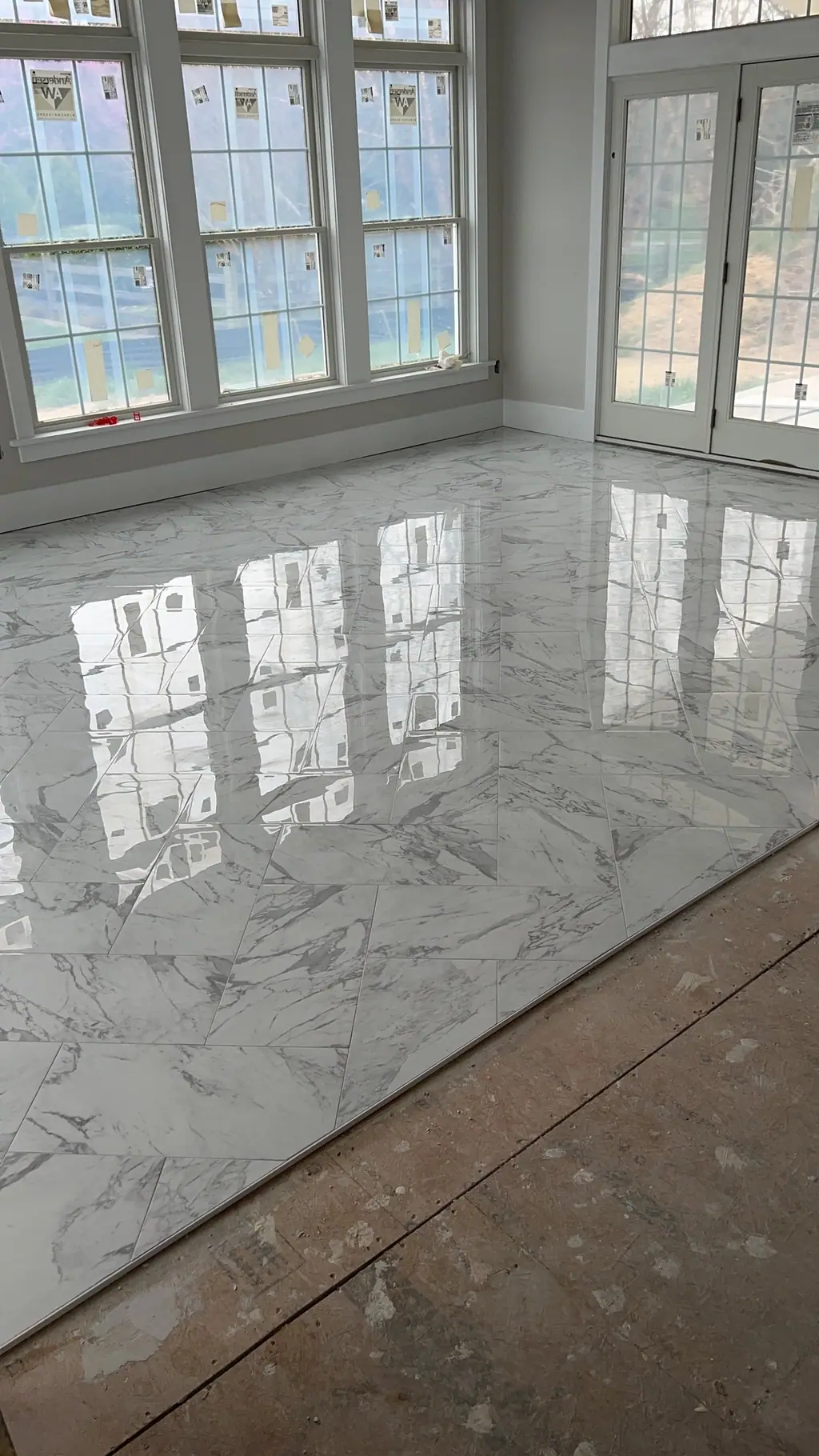 Polished marble-look porcelain floor in a sunroom
